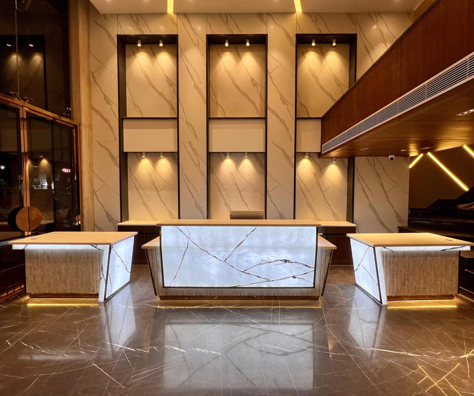 Check-in lobby with 24-hour reception and seating — The Prime Delhi Hotel